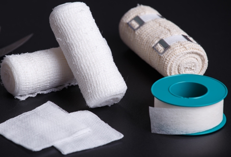 Medical bandages with scissors and sticking plaster